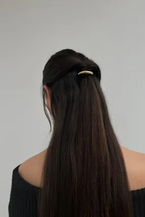 ABSTRACT PIPE-SHAPED HAIR CLIP